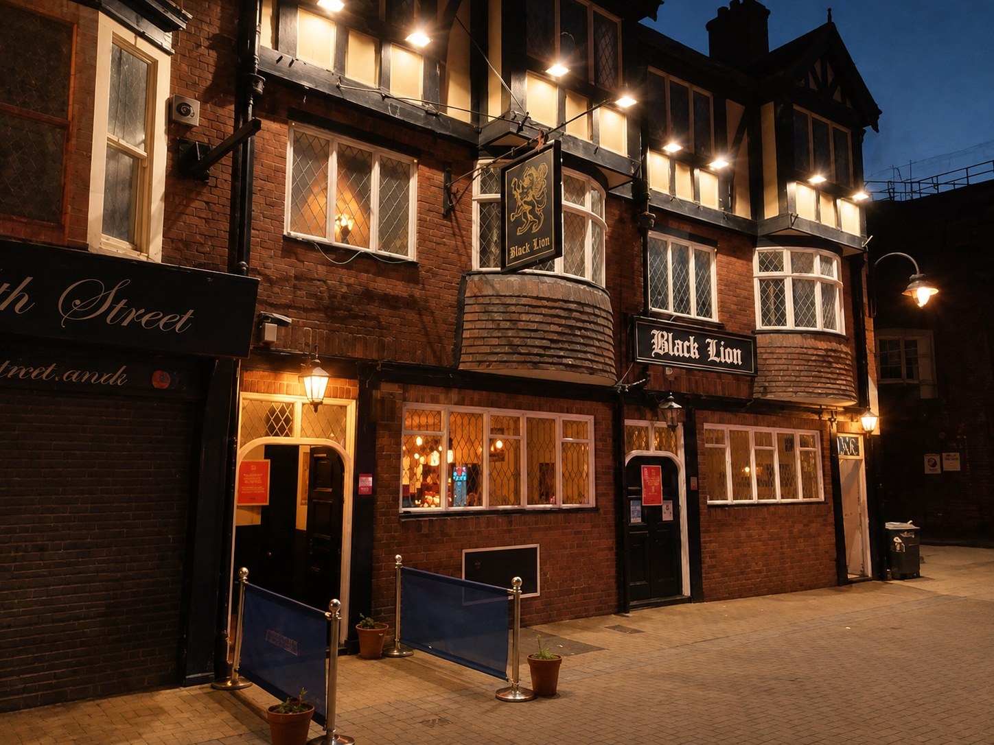 The Black Lion pub glowing at night on North Street, Scarborough